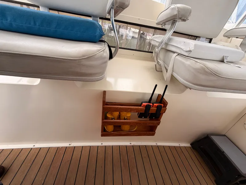 Slide: The Image of Interior of a 1987 Viking DBL Cabin Yacht with seating and radios. - 36