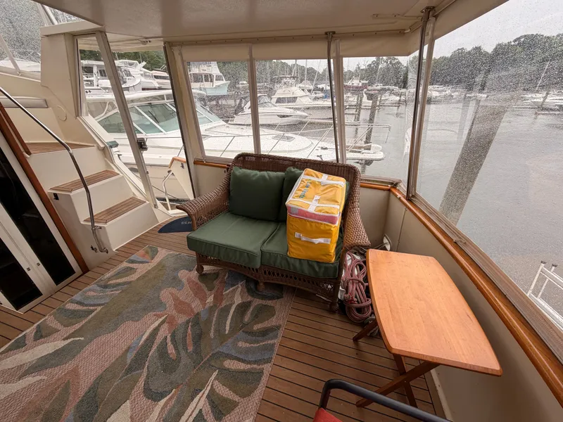 Slide: The Image of Interior of 1987 Viking DBL Cabin Yacht with sofa and table. - 39