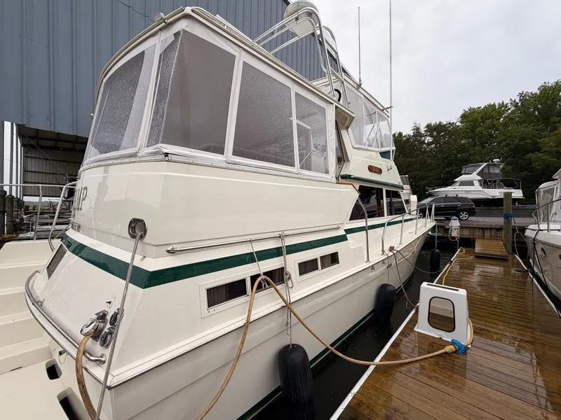 Slide: The Image of 1987 Viking DBL Cabin Motor Yacht at dock. - 4