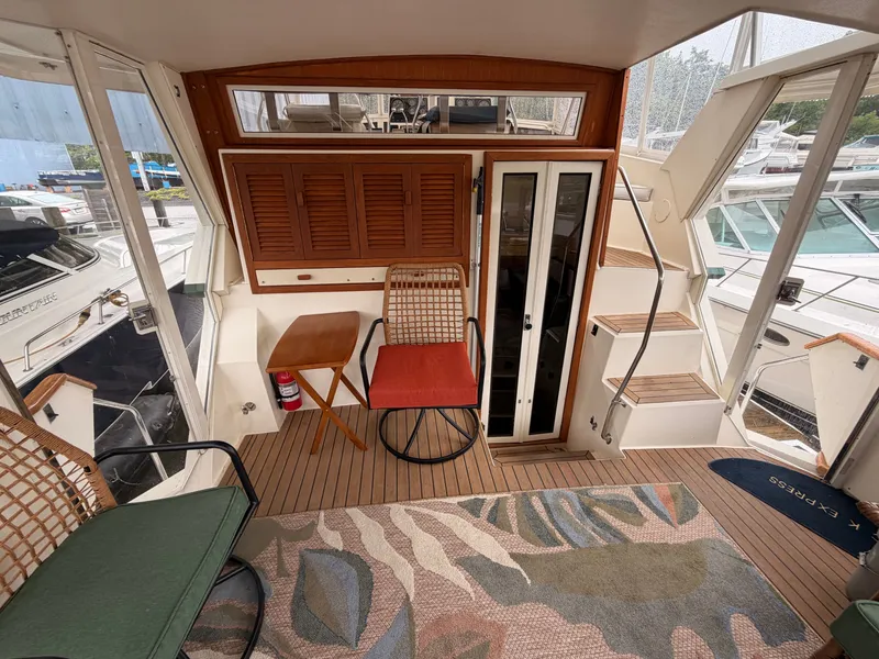 Slide: The Image of Interior of a 1987 Viking DBL Cabin Motor Yacht with seating area. - 40