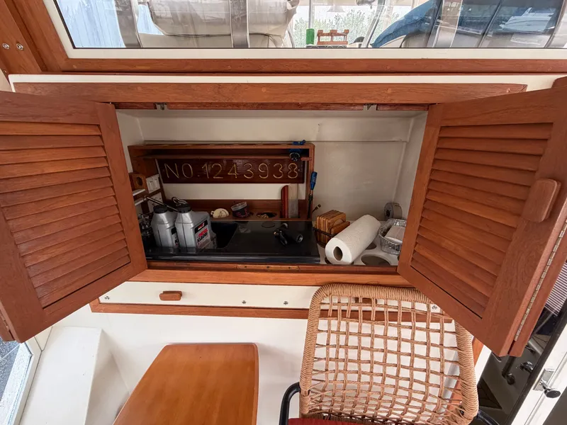 Slide: The Image of Interior of a 1987 Viking DBL Cabin Yacht with wooden cabinets. - 42