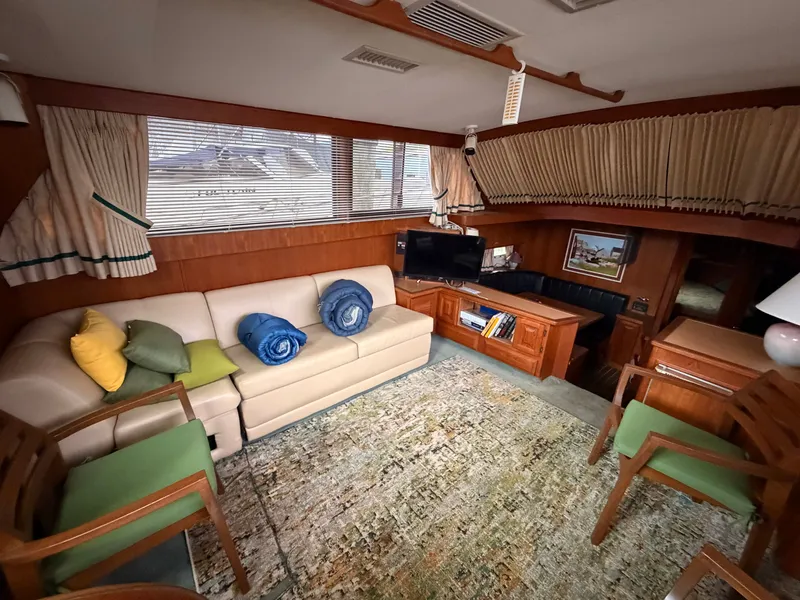 Slide: The Image of Interior of a 1987 Viking DBL Cabin Motor Yacht with sofa and TV. - 45