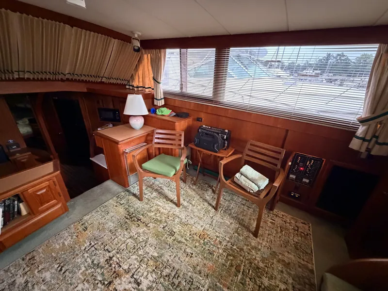 Slide: The Image of Interior of a 1987 Viking DBL Cabin Motor Yacht with wooden furnishings. - 46