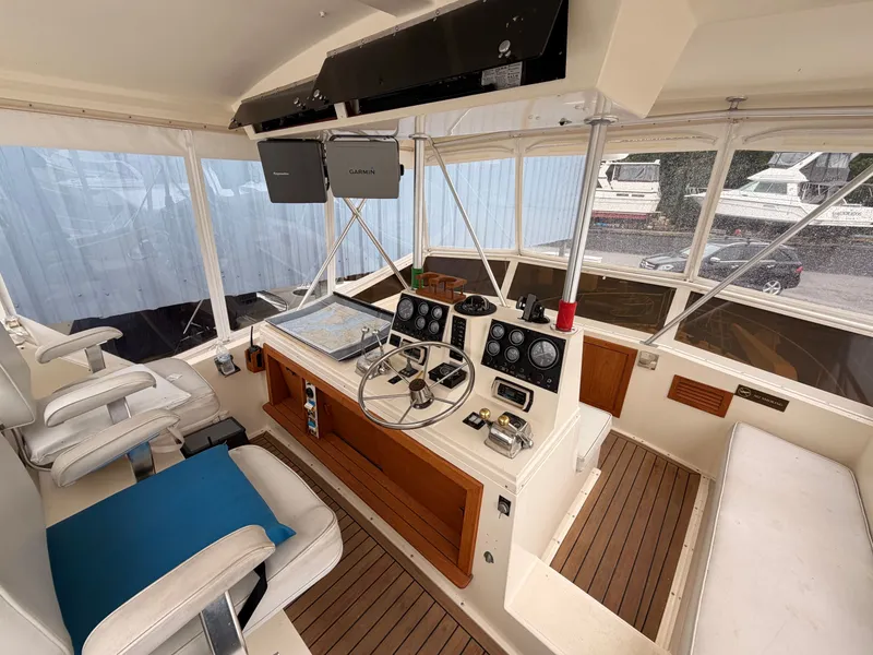 Slide: The Image of Interior of a 1987 Viking DBL Cabin Motor Yacht with helm console. - 6