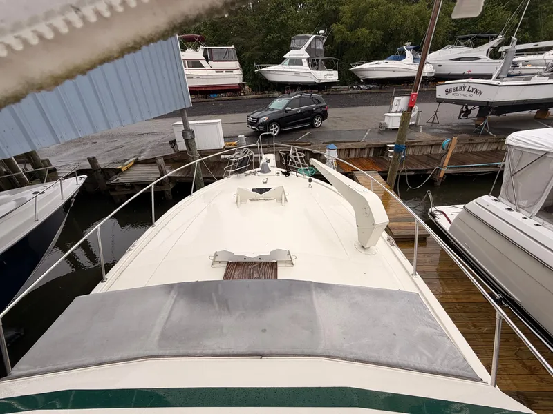 Slide: The Image of 1987 Viking DBL Cabin Motor Yacht docked at marina. - 8
