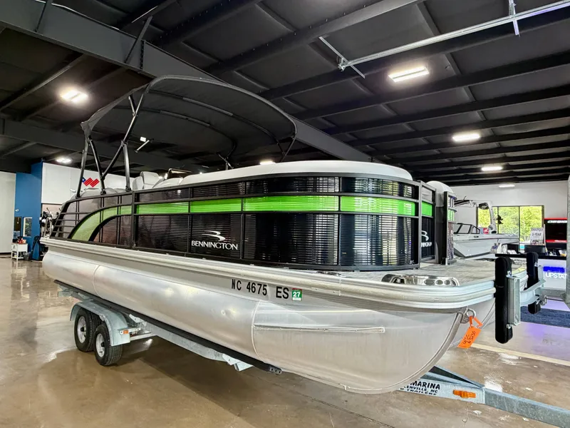 Slide: The Image of 2020 Bennington G22 pontoon boat in showroom on trailer. - 3