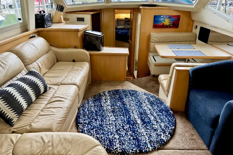 Slide: The Image of Luxurious interior of 1998 Carver 355 Aft Cabin Motor Yacht with cozy seating and decor. - 12