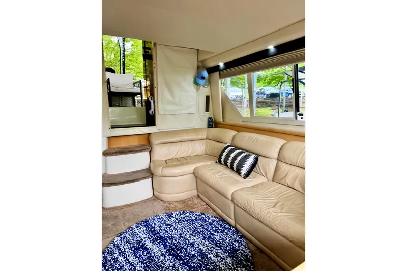 Slide: The Image of Luxurious interior of 1998 Carver 355 Aft Cabin Motor Yacht with beige leather seating. - 15