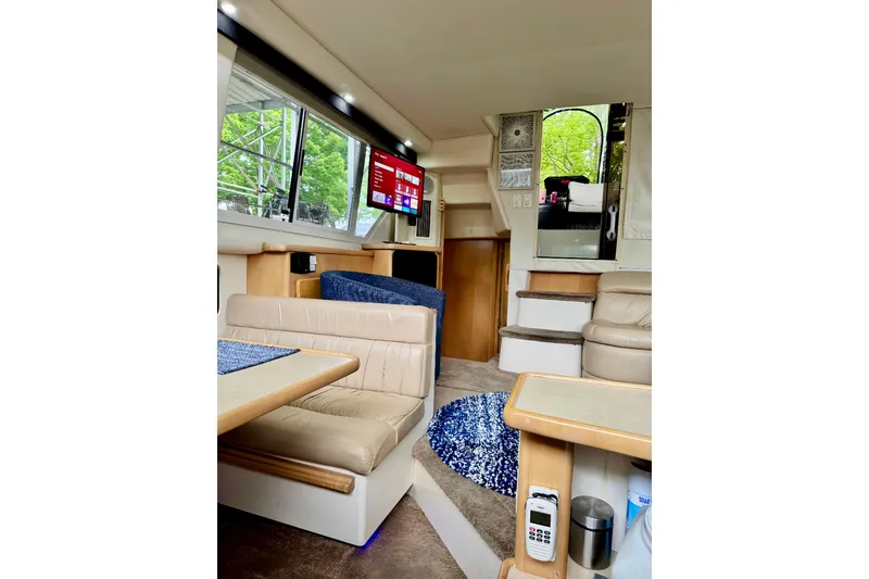 Slide: The Image of Interior of 1998 Carver 355 Aft Cabin Motor Yacht with seating and TV. - 17