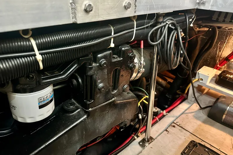 Slide: The Image of Engine room of 1998 Carver 355 Aft Cabin Motor Yacht, showcasing mechanical components. - 26