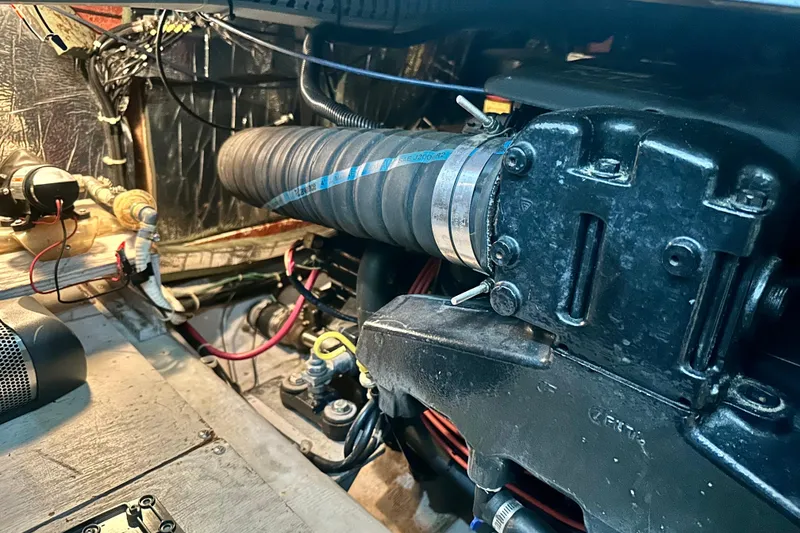 Slide: The Image of Engine compartment of a 1998 Carver 355 Aft Cabin Motor Yacht, showcasing mechanical components. - 27