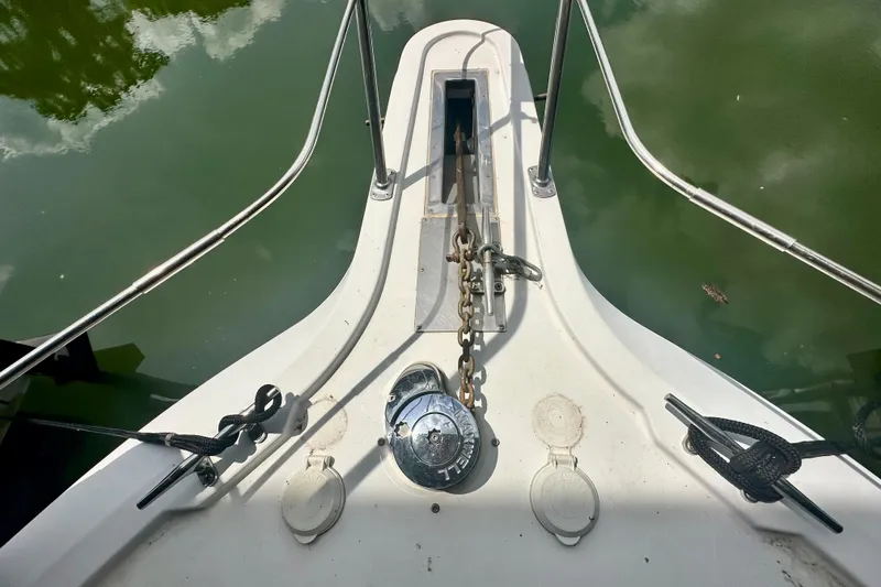 Slide: The Image of Bow of 1998 Carver 355 Aft Cabin Motor Yacht with anchor chain and winch. - 7