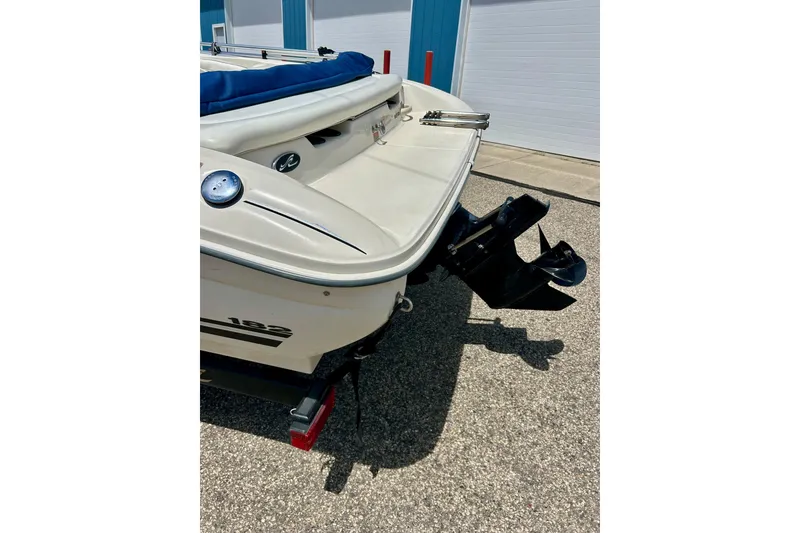 Slide: The Image of Rear view of a 2001 Sea Ray 182 Bow Rider boat with outboard motor. - 11