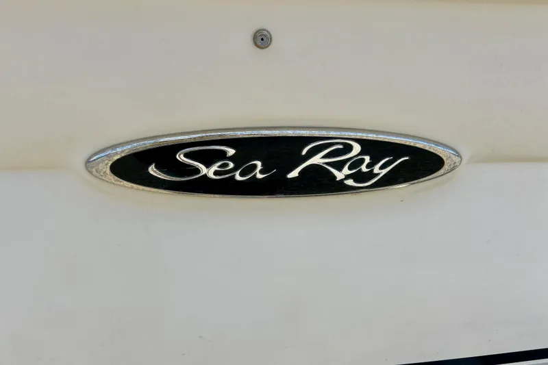 Slide: The Image of Sea Ray logo on 2001 Sea Ray 182 Bow Rider boat, black and silver emblem. - 12