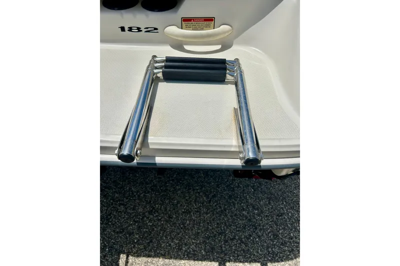 Slide: The Image of Stainless steel swim ladder on 2001 Sea Ray 182 Bow Rider boat. - 13
