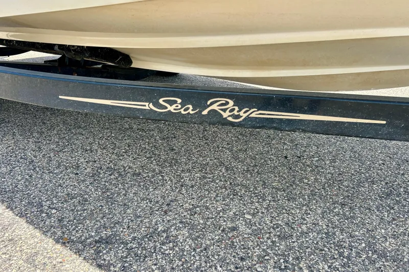 Slide: The Image of 2001 Sea Ray 182 Bow Rider boat trailer on asphalt surface. - 15