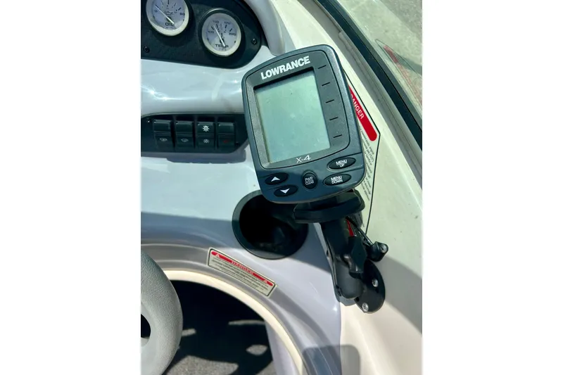 Slide: The Image of Dashboard of a 2001 Sea Ray 182 Bow Rider with Lowrance X-4 fish finder. - 16