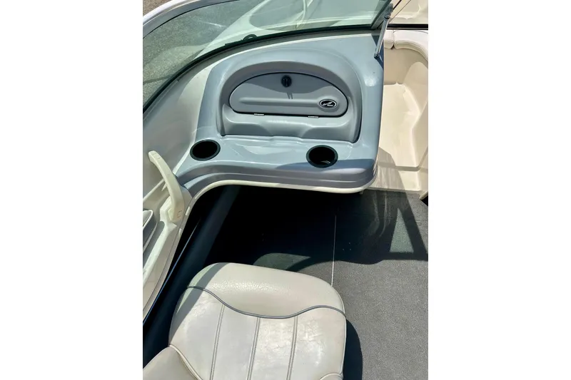 Slide: The Image of Interior of a 2001 Sea Ray 182 Bow Rider boat with seating and cup holders. - 20