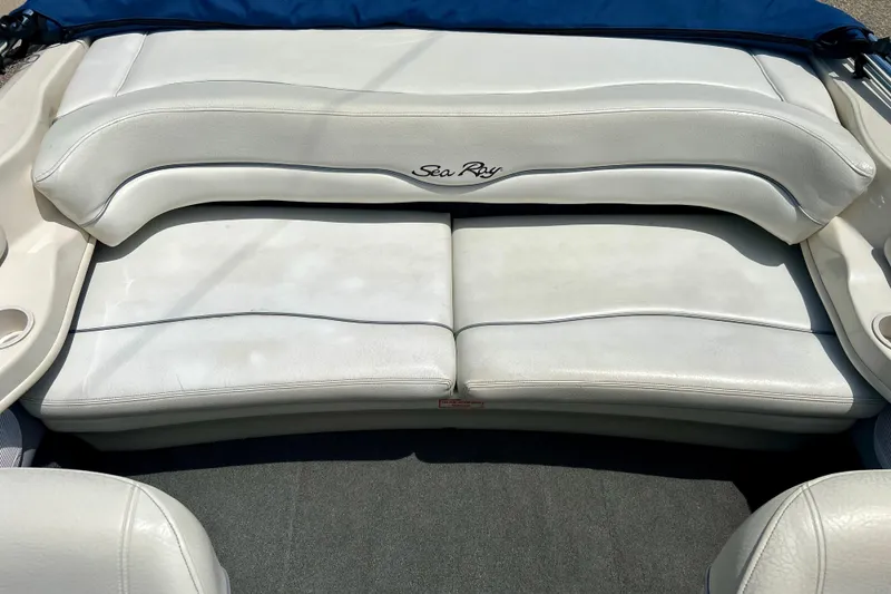 Slide: The Image of 2001 Sea Ray 182 Bow Rider boat interior with white cushioned seating. - 21