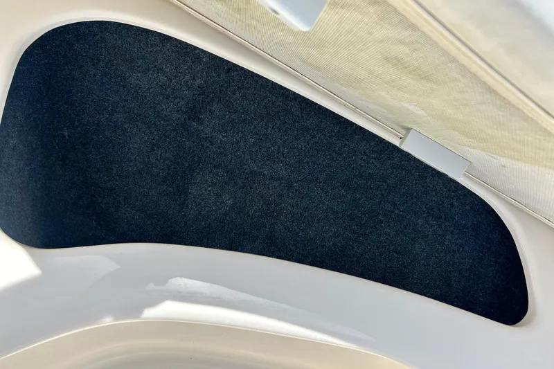 Slide: The Image of Interior view of a 2001 Sea Ray 182 Bow Rider boat compartment. - 23
