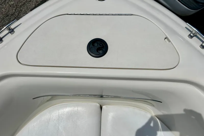 Slide: The Image of 2001 Sea Ray 182 Bow Rider boat bow with storage compartment and seating. - 25