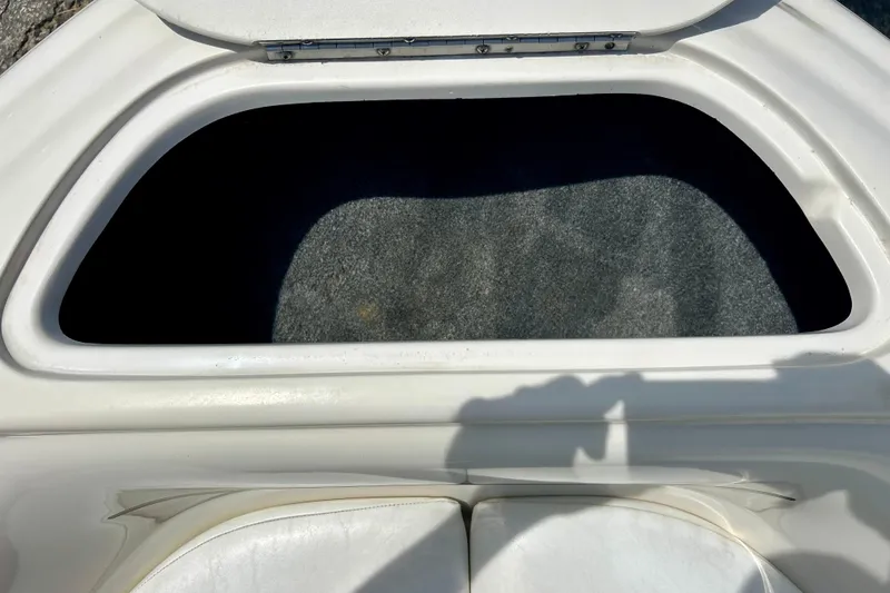 Slide: The Image of Open storage compartment on a 2001 Sea Ray 182 Bow Rider boat. - 26