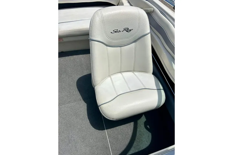 Slide: The Image of White leather seat in a 2001 Sea Ray 182 Bow Rider boat. - 27