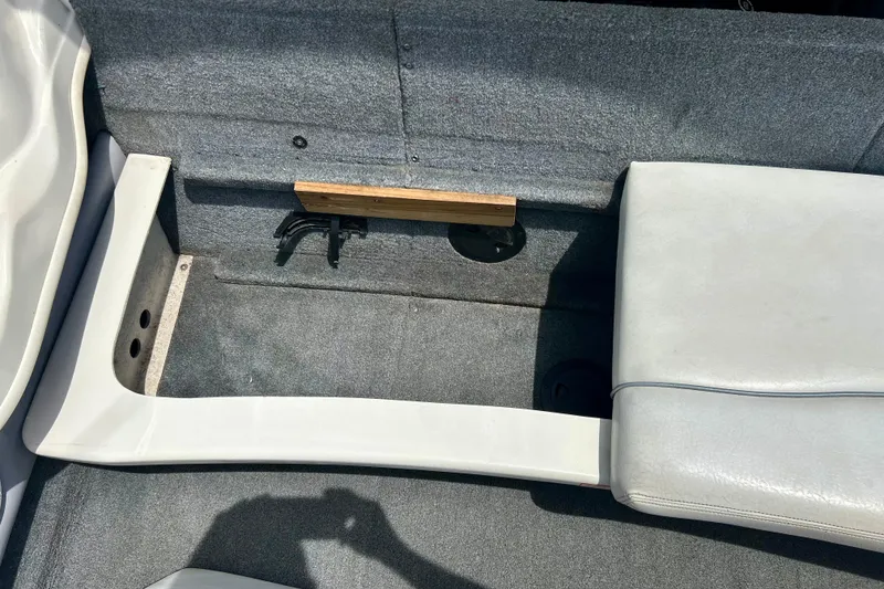 Slide: The Image of Interior of a 2001 Sea Ray 182 Bow Rider boat showing seating and storage area. - 29