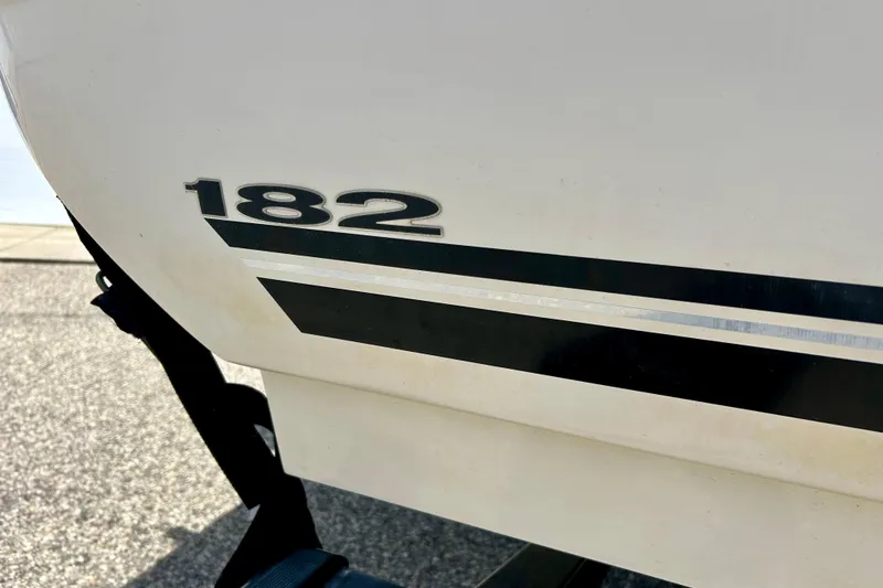 Slide: The Image of 2001 Sea Ray 182 Bow Rider boat with black stripe detail. - 3