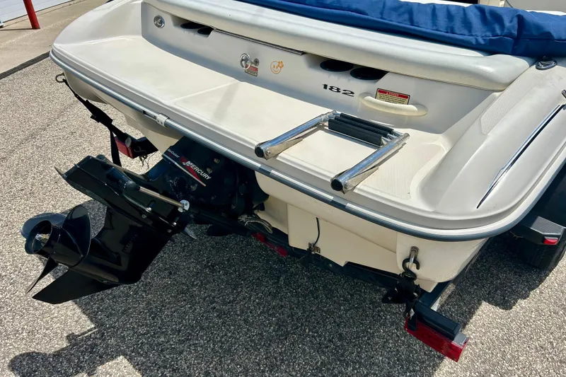 Slide: The Image of Rear view of a 2001 Sea Ray 182 Bow Rider boat with Mercury outboard motor. - 6