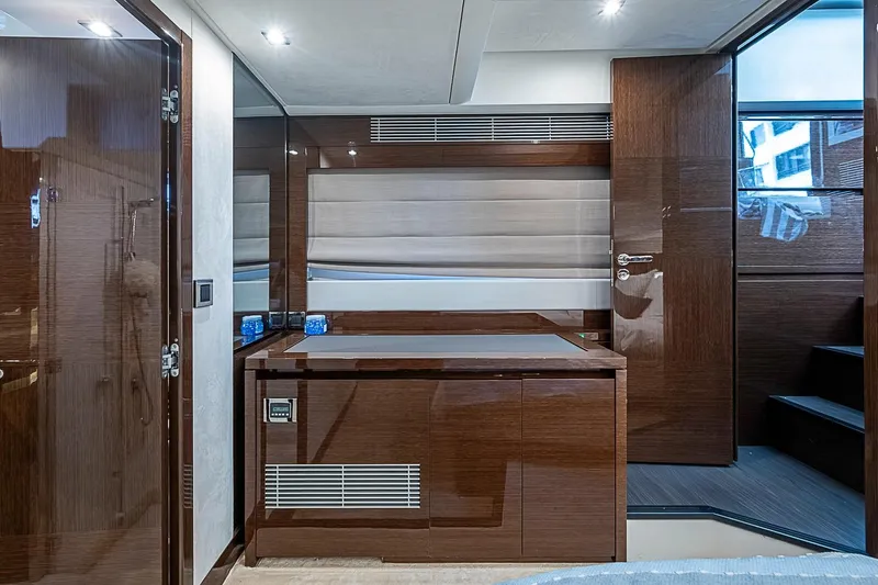 Slide: The Image of Luxurious interior of a 2021 Prestige 520 yacht, featuring sleek wood finishes and modern design. - 30