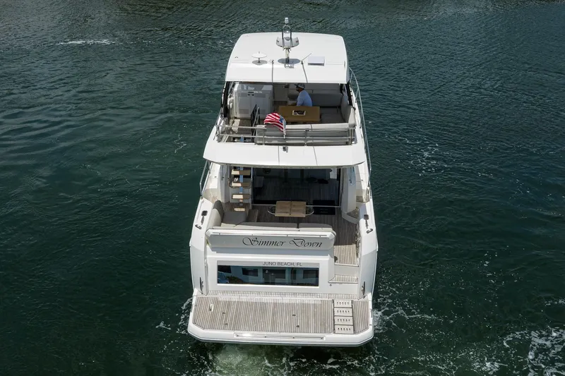 Slide: The Image of Aerial view of 2021 Prestige 520 yacht cruising on open water. - 44