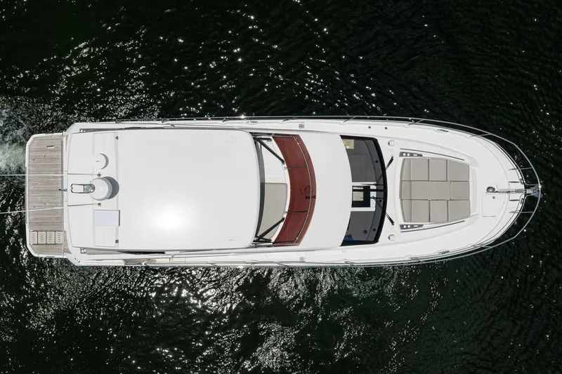 Slide: The Image of Top view of a 2021 Prestige 520 yacht on water, showcasing sleek design and spacious deck. - 45