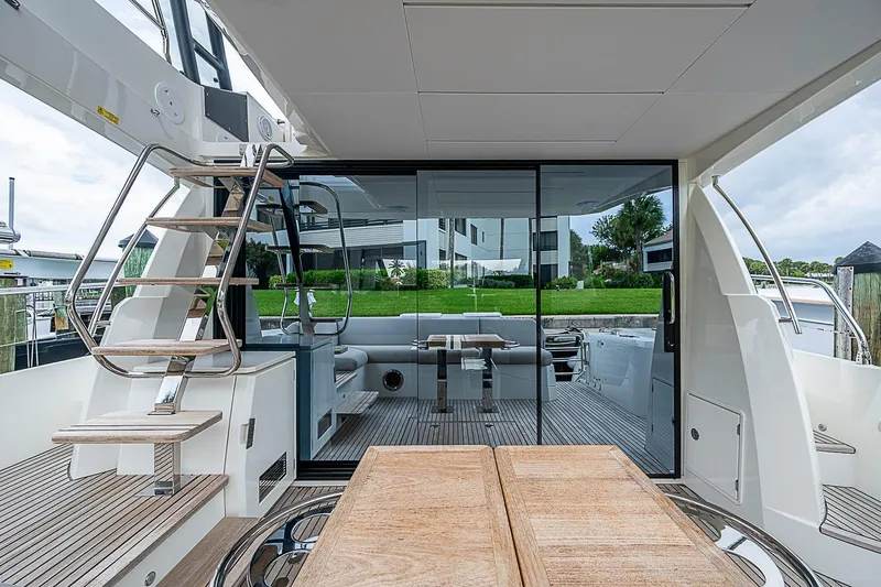 Slide: The Image of Luxury 2021 Prestige 520 yacht interior with wooden deck and modern design. - 49