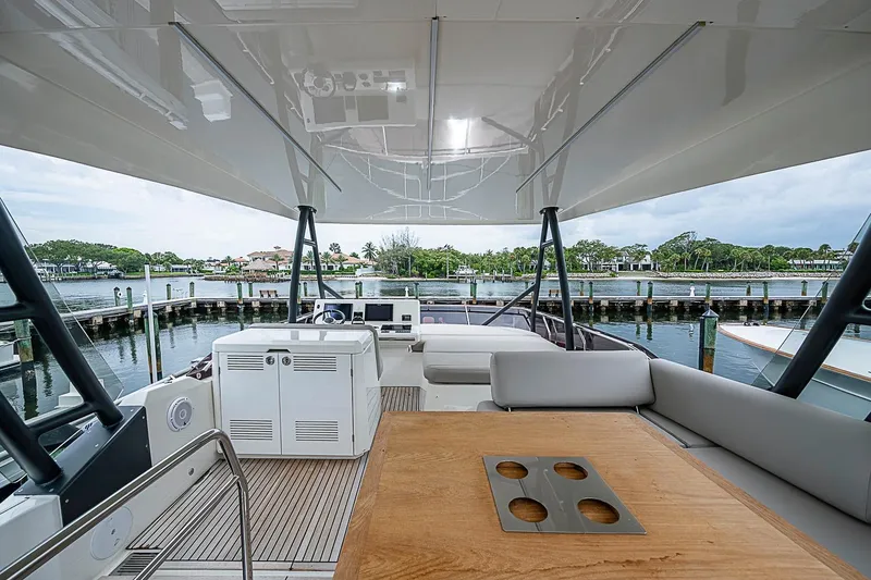 Slide: The Image of Luxurious 2021 Prestige 520 yacht interior with elegant seating and scenic waterfront view. - 51