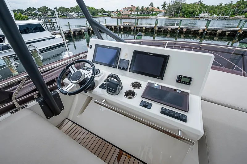 Slide: The Image of Helm station of 2021 Prestige 520 yacht with modern navigation equipment. - 55
