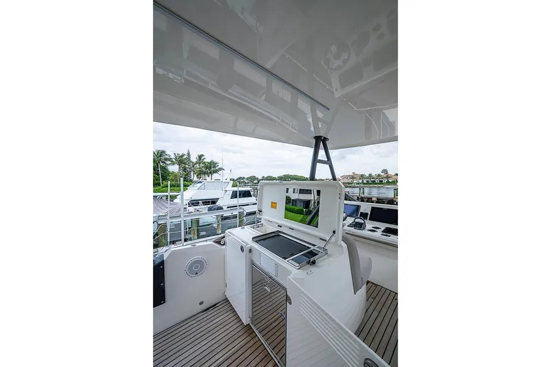 Slide: The Image of Prestige 520 yacht interior, 2021 model, featuring modern navigation equipment and sleek design. - 56