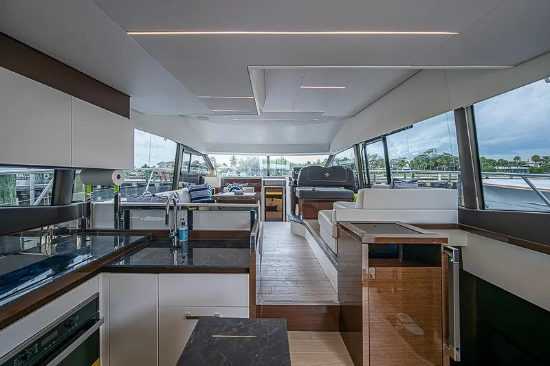 Slide: The Image of Luxurious interior of a 2021 Prestige 520 yacht with modern furnishings and panoramic windows. - 57