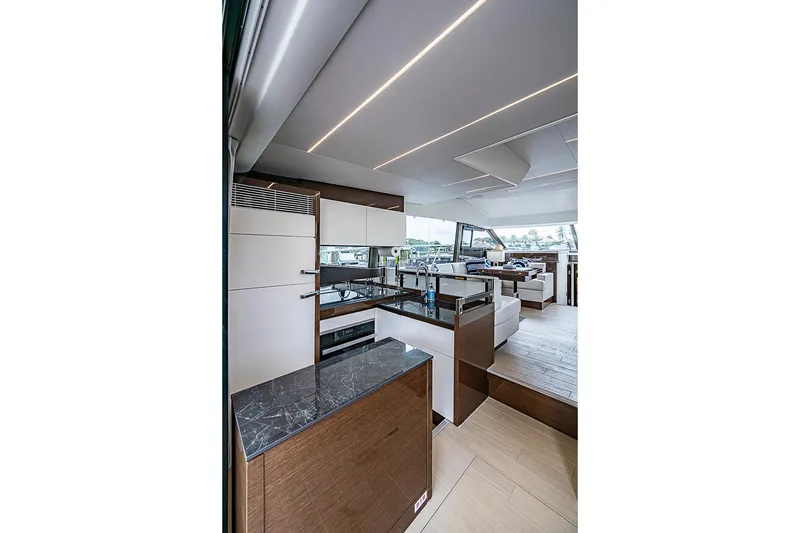 Slide: The Image of Luxurious interior of 2021 Prestige 520 yacht featuring modern kitchen and seating area. - 58