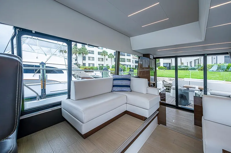 Slide: The Image of Luxurious interior of 2021 Prestige 520 yacht with modern seating and large windows. - 66