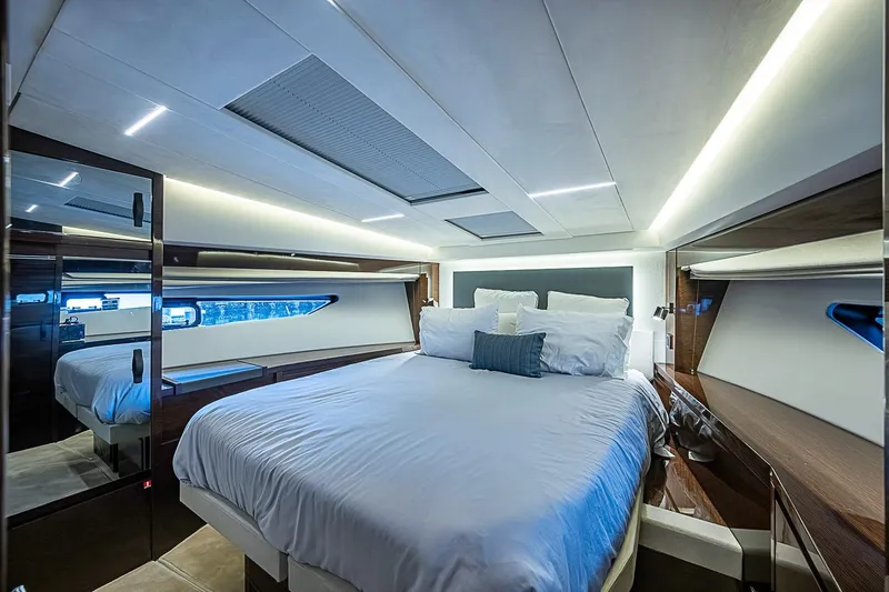 Slide: The Image of Luxurious bedroom interior of 2021 Prestige 520 yacht with modern lighting and elegant design. - 68