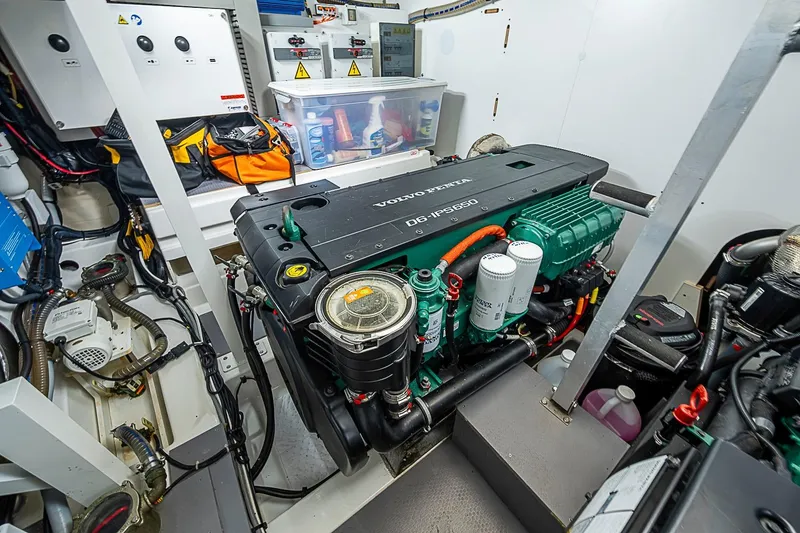 Slide: The Image of Engine room of a 2021 Prestige 520 yacht featuring a Volvo Penta D6-IPS650 engine. - 73