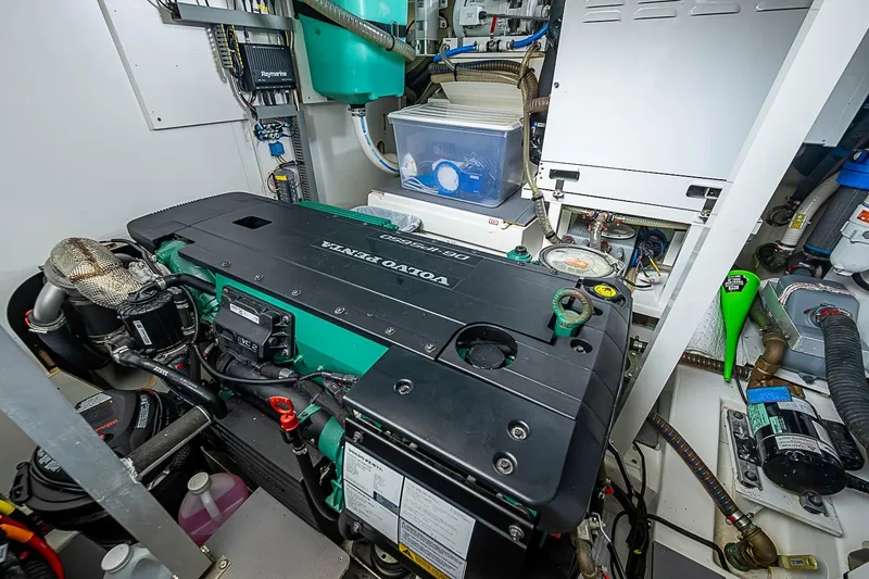 Slide: The Image of Engine room of a 2021 Prestige 520 yacht featuring a Volvo Penta engine. - 74