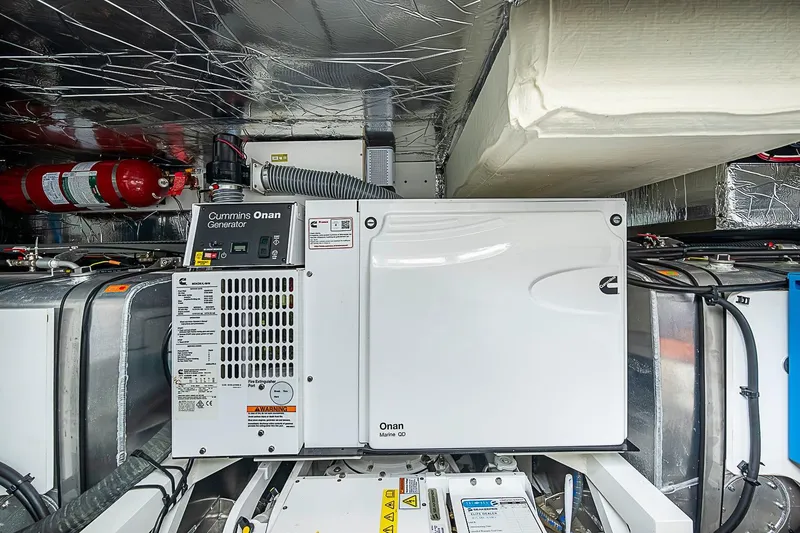 Slide: The Image of Engine room of 2021 Prestige 520 yacht with Cummins Onan generator. - 75