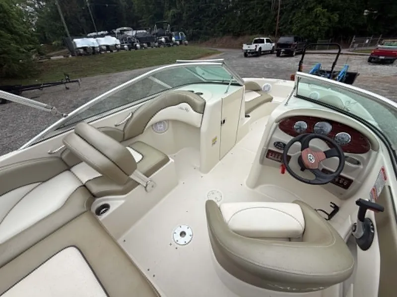 Slide: The Image of Interior of a 2006 Sea Ray 200 SD boat, beige upholstery. - 13
