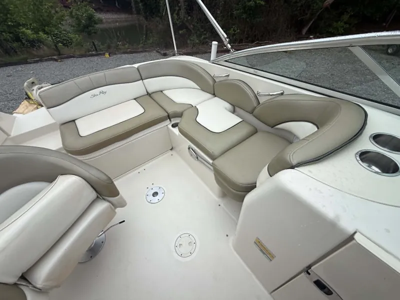 Slide: The Image of Interior of a 2006 Sea Ray 200 SD boat with beige seating. - 15