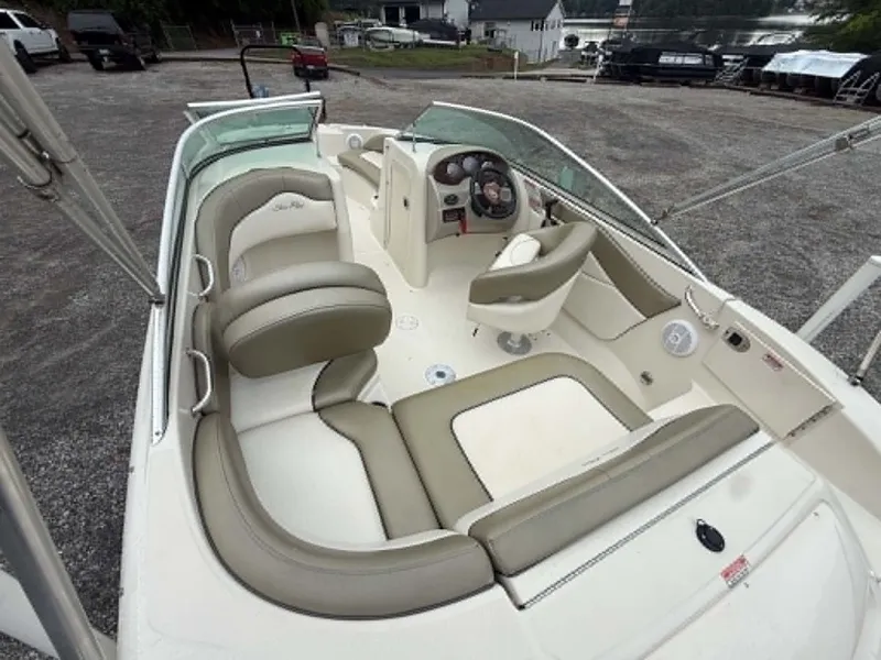 Slide: The Image of Interior of a 2006 Sea Ray 200 SD boat with beige seating. - 2
