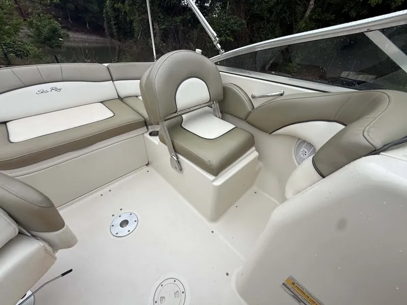 Slide: The Image of Interior of a 2006 Sea Ray 200 SD boat with beige seating. - 21