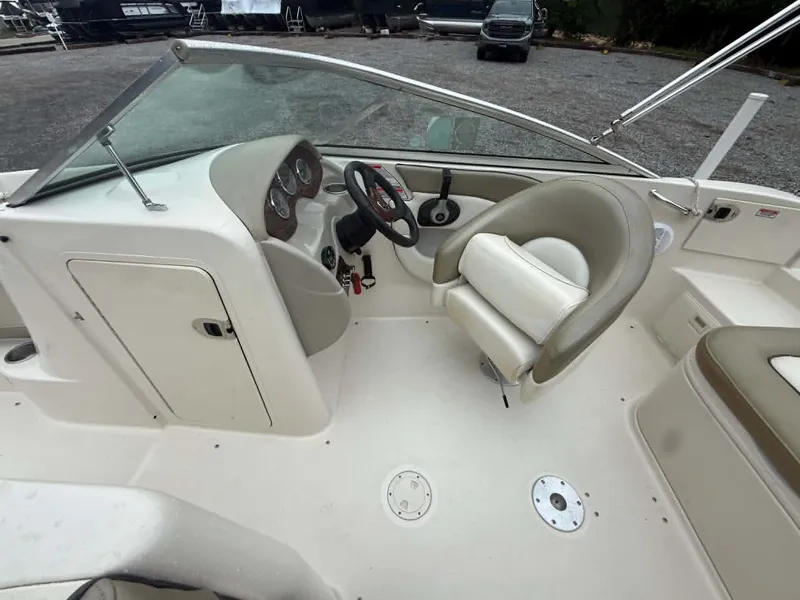 Slide: The Image of Interior of a 2006 Sea Ray 200 SD boat with steering console. - 24