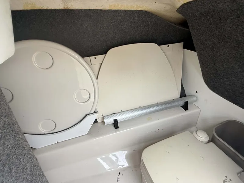 Slide: The Image of Interior of a 2006 Sea Ray 200 SD boat with storage area. - 26